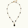 Golden necklace with black crystal details and pendant - Anton Heunis