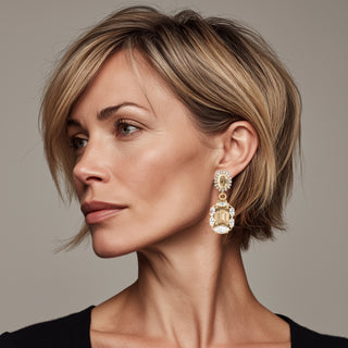 Woman wearing champagne drop statement earrings with crystal details - Anton Heunis Handmade Jewelry