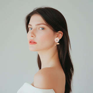 Woman wearing delicate daisy earrings with crystals - Anton Heunis