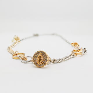 Detail of mixed metals necklace with rings