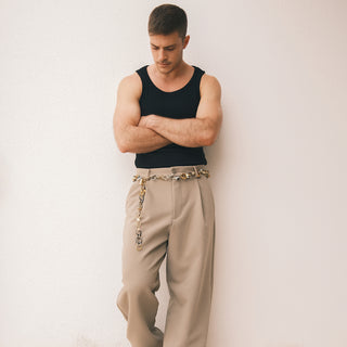 Man wearing a belt of vintage rings - Anton Heunis