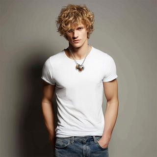 Man wearing a silver chain necklace with dangly vintage rings mixed metals - Anton Heunis