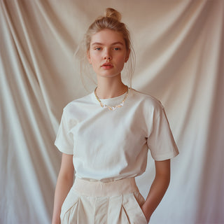 Model wearing Golden necklace with three crystal sun ray details - Anton Heunis