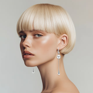 Model wearing Silver drop earrings with hook - Anton Heunis