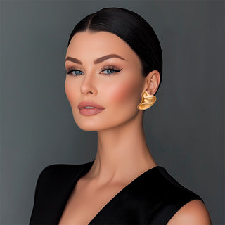 Woman wearing Gold liquid metal statement earrings - Anton Heunis 