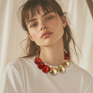 Woman wearing Statement oversize bead necklace gold and red - Anton Heunis