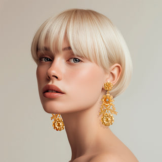 Woman wearing Stunning golden statement flower light earrings - Anton Heunis
