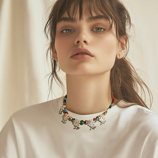 Woman wearing beaded necklace with dainty crystal daisies - Anton Heunis