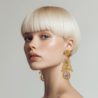 Woman wearing long statement golden flower earrings with colorful bead details - Anton Heunis